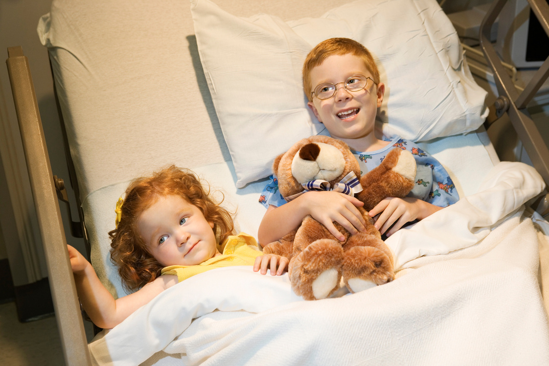 Children in hospital bed